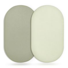 two oval pads are shown side by side on a white background, one is light green and the other is dark gray