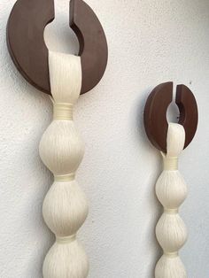 two white and brown decorative objects on the wall