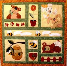 a quilted wall hanging with pictures of animals and bees on it's sides