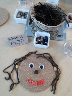 a cork board with a face made to look like a man's head and eyes