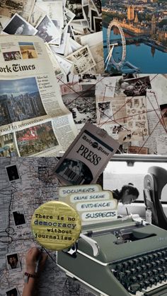 an old typewriter surrounded by newspaper and photos