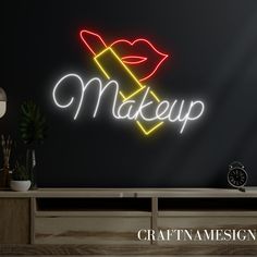 a neon sign that says make up on the side of a wall next to a clock