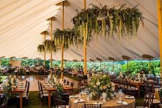 a large tent with tables and chairs set up for an event