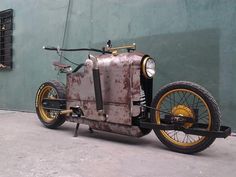 an old fashioned motorcycle is parked on the street