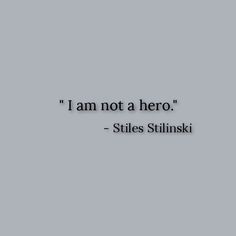 the words i am not a hero are in black and white on a gray background