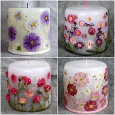 four different colored candles with flowers painted on them