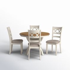 a table with four chairs around it