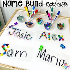 the name build light table is filled with letters and magnets for kids to write