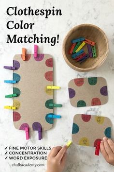 two children's hands playing with colored wooden pegs