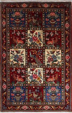 an antique persian rug with birds and flowers