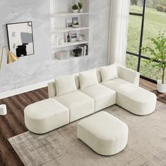 a living room with a large white sectional couch