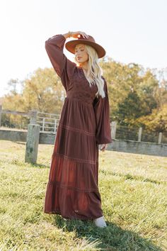 Step into timeless elegance with the Brown V Neck Embroidered Maxi Dress, a must-have for effortless boho style! Designed with long balloon sleeves that add a touch of drama to the silhouette. Features a front and back V neckline for a flattering and chic look. The back tie closure adds a delicate detail, ensuring a perfect fit. Intricate embroidered detailing elevates the dress while the tiered, maxi length makes it ideal for both daytime outings and special evenings. Pair with strappy sandals or ankle boots for an enchanting look that's perfect for any occasion! Long Sleeve Brown Bohemian Boho Dress, Flowy Brown Bohemian Maxi Dress, Brown V-neck Boho Dress For Fall, Summer Brown Boho Dress With V-neck, Country Western Dresses, Brown Bohemian V-neck Maxi Dress, Revival Clothing, Wedding Guest Outfit Fall, Fall Style Guide