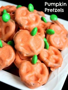 pumpkin pretzels with green candies and candy