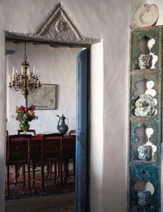 an open door leading into a dining room