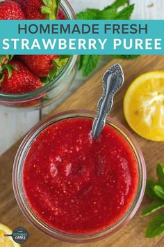 homemade fresh strawberry puree in a jar with lemons and mint on the side