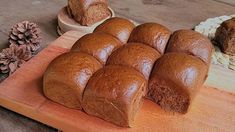 several loaves of bread on a cutting board