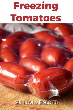 a bag of tomatoes sitting on top of a wooden table