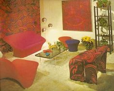 an image of a living room setting with red and black decor on the walls, couches and chairs