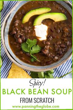 black bean soup in a bowl with avocado and cilantro on the side