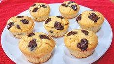 chocolate chip muffins are on a white plate