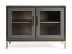 the sideboard has two glass doors and is made from wood with metal trimmings