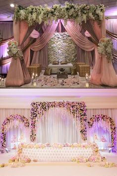 wedding stage decorated with pink and white flowers