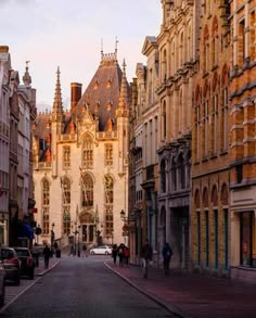 an old city street lined with tall buildings