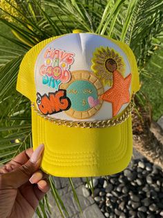 Brighten up your summer with our "Have a Good Day" Trucker Cap! This trendy, custom cap features a cheerful yellow design with a cool sunshine patch theme, perfect for spreading positivity. Adorned with a multi-color sequin star, this fun trucker hat is a stylish addition to any outfit. Ideal for sunny days and outdoor adventures, this cap ensures you stay cool and comfortable while making a statement. Details: Design: "Have a Good Day" with sunshine patch and multi-color sequin star Color: Vibrant yellow Material: High-quality, breathable fabric Fit: Adjustable snapback for a comfortable fit Uses: Perfect for summer, outdoor activities, and casual wear Special Feature: Customizable for a unique touch Stay trendy and spread good vibes with this fun trucker hat, and make every day a good da Trendy Yellow Trucker Hat For Spring, Trendy Yellow Snapback Hat With Curved Brim, Multicolor Summer Baseball Cap For Vacation, Multicolor Summer Trucker Hat For Vacation, Multicolor Trucker Hat For Summer Vacation, Trendy Summer Baseball Cap With Flat Brim, Cute Summer Baseball Cap, Yellow Trucker Hat With Curved Brim For Spring, Trendy Yellow Snapback Hat For Summer