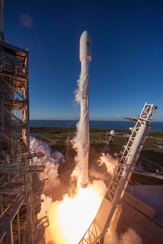 a rocket is being launched into the sky