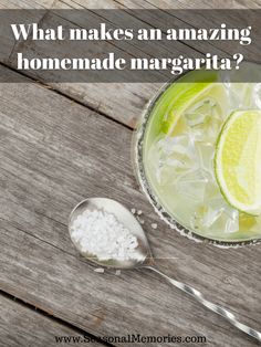 what makes an amazing homemade margarita? with limes and salt in a glass on a wooden table