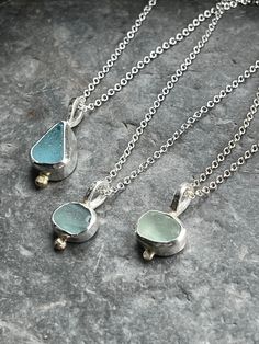 Beautiful, small pieces of sea glass, found on beaches local to me around Fowey on the south coast of Cornwall, are set in a purpose made sterling and fine silver bezel, with a little nugget of recycled 9ct gold, and suspended on your choice of 16"/40cm, 18"/45cm, or 20"/50cm chain. The sea glass pieces are approximately 0.7cm to 1cm. All of my silver jewellery is beautifully wrapped and boxed in my branded packaging :) Sea Glass Pendant, Sea Glass Necklace, Sea Glass Jewelry, Jewelry Inspo, Fine Silver, Sea Glass, Gold Pendant, Silver Necklaces, Womens Necklaces