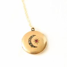 Antique Crescent Moon and Star Locket Necklace. This gold filled  locket has 7 paste stones in the crescent moon and 1 red paste stone for the star. Locket opens and closes easily. The gold filled chain was added by me, not vintage. The back of the locket is plain. Circa early 1900's No hallmarks Measurements: Chain is 18 inches Locket is 1 inch Very good condition. No frames inside of locket. Stones have darkened due to age. Minor wear due to use and age. *price reduced from $325 to 295 Heirloom Crescent Jewelry For Gifts, Heirloom Crescent Jewelry Gift, Antique Moon Shaped Jewelry For Gift, Antique Moon Shaped Jewelry Gift, Antique Moon-shaped Jewelry Gift, Victorian Crescent Jewelry As Gift, Victorian Crescent Jewelry For Gifts, Victorian Crescent Jewelry Gift, Victorian Crescent Wedding Jewelry