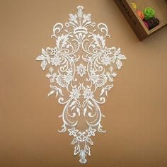 a piece of paper that has been cut out to look like an intricate design on the wall