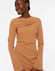 An elevated piece that speaks to evening dressing, the ESCAPADE dress features a twist at the front and ruched details taht gather the fabric creating a flattering look. With the side slits it is a chic answer to occasionwear.The model is 178 cm and wears a size S.Composition: 51% RPES, 39% PES, 10% ELMachine wash delicate 30 celsius, do not bleach, iron on a low temperature without steaming, do not tumble dry, do not dry clean. Shine may appear while ironing.Size and fit:To make sure you choose the right piece, please follow the size chart below! XS S M L XL Chest 84 cm 88 cm 92 cm 96 cm 102 cm Waist 66 cm 70 cm 74 cm 78 cm 84 cm Hip 94 cm 98 cm 102 cm 106 cm 112 cm Arm length 69 cm 59,5 cm 71 cm 71,5 cm 73 cm Arm width 30,5 cm 31,5 cm 32,5 cm 33,5 cm 35 cm Front length 129 cm 130 cm 132, Brown Draped Evening Dress, Formal Ruched Sheath Mini Dress, Chic Brown Draped Dress, Chic Ruched Mini Dress For Work, Chic Long Sleeve Midi Dress With Ruched Sides, Elegant Brown Draped Dresses, Elegant Mini Dress With Ruched Sides And Asymmetrical Neckline, Elegant Mini Dress With Asymmetrical Neckline And Ruched Sides, Elegant Draped Brown Dress