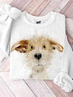 a white sweater with an image of a dog's face on the front and side