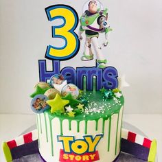 a toy story birthday cake with the number three on it's top and an image of buzz lightyear