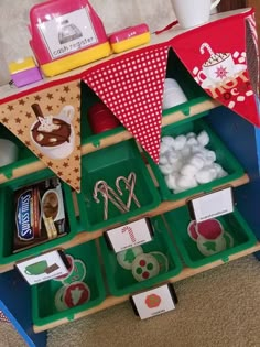 an assortment of food items displayed in trays on carpeted area with coffee cup and teapot