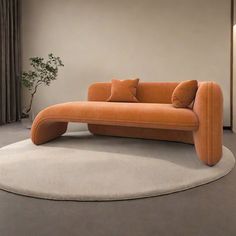 an orange couch sitting on top of a white rug