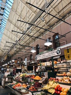 the inside of a grocery store filled with fresh fruits and vegetables