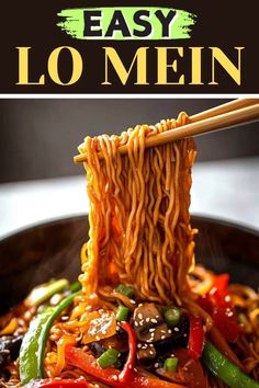 an easy lo mein recipe with chopsticks and vegetables in a wok on the table