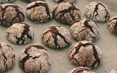 chocolate crinkle cookies on a baking sheet ready to be baked in the oven