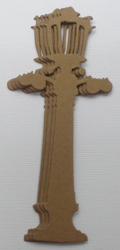 a cardboard cut out of the shape of a cross