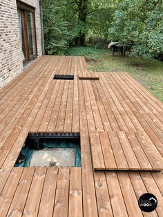 a wooden deck with a hole in the middle