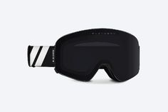 a pair of ski goggles with black and white stripes on the front, one eye closed