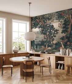 a dining room with a table and chairs in front of a wallpapered mural