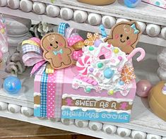 there is a box that has some decorations on it and two teddy bears in the box