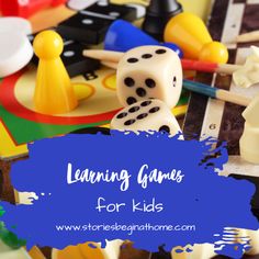 the words learning games for kids are in front of some dices and other toys