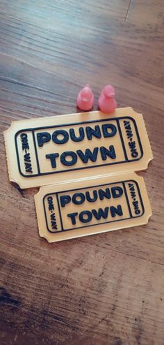 two stickers that say pound town and pink gummy bears sitting on top of each other