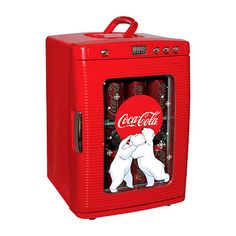 an old fashioned coca cola cooler with two polar bears on the front and one in the back