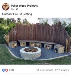 an outdoor fire pit surrounded by wooden fence